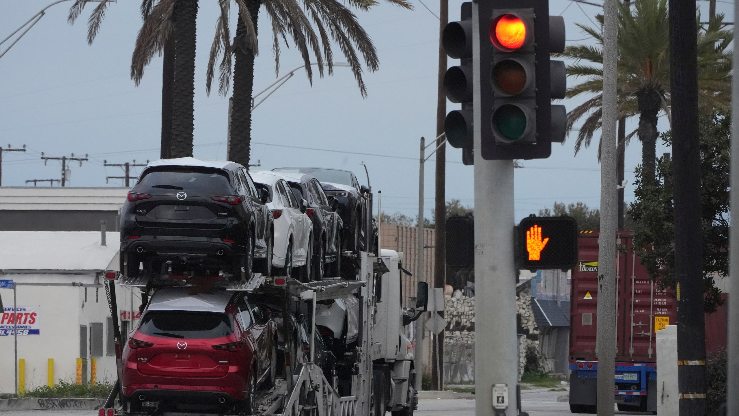 New Mazda SUVs are transported at the Port of Long Beach in Long Beach, Calif., Wednesday, March 26, 2025. (AP Photo/Damian Dovarganes)
