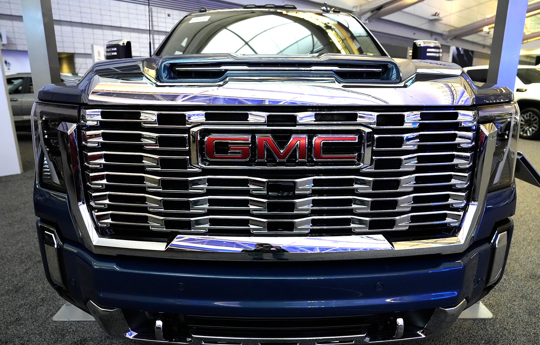 FILE - This is the grill on a GMC Sierra Heavy Duty Denali HD 2500 truck on display at the Pittsburgh International Auto Show in Pittsburgh, Feb. 15, 2024. (AP Photo/Gene J. Puskar, File)