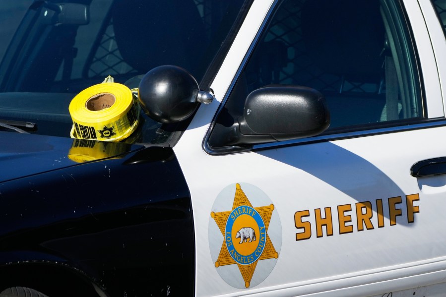 FILE - A roll of police tape is left on the windshield of Los Angeles County sheriff's vehicle in the parking lot of its training academy in Whittier, Calif., Wednesday, Nov. 16, 2022. (AP Photo/Jae C. Hong, File)