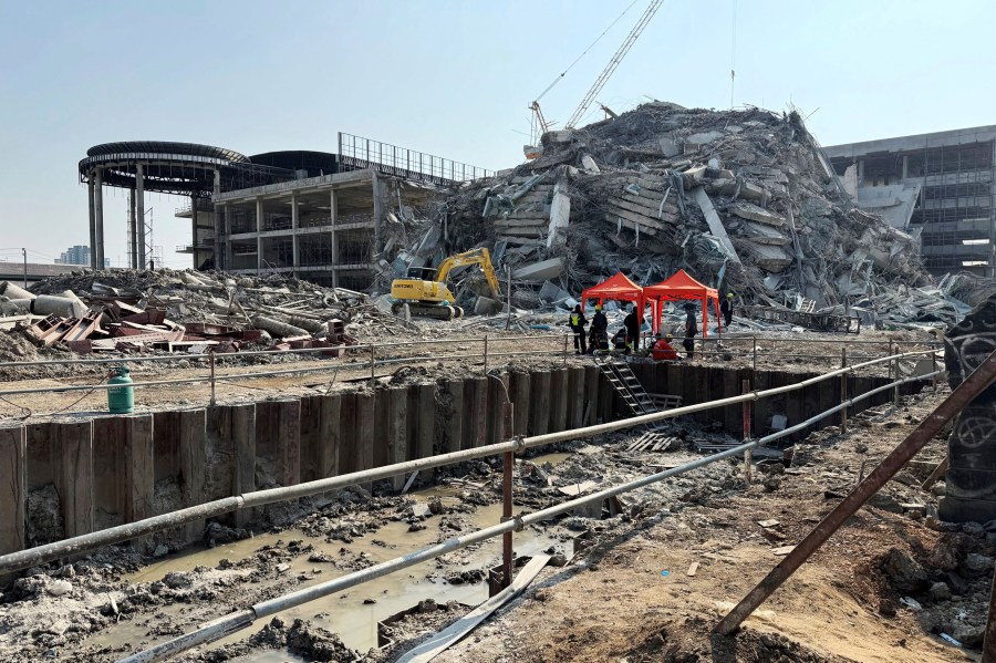 Rescuers work at the site a high-rise building under construction that collapsed after a 7.7 magnitude earthquake in Bangkok, Thailand, Friday, March 28, 2025. (AP Photo/Wason Wanichakorn)