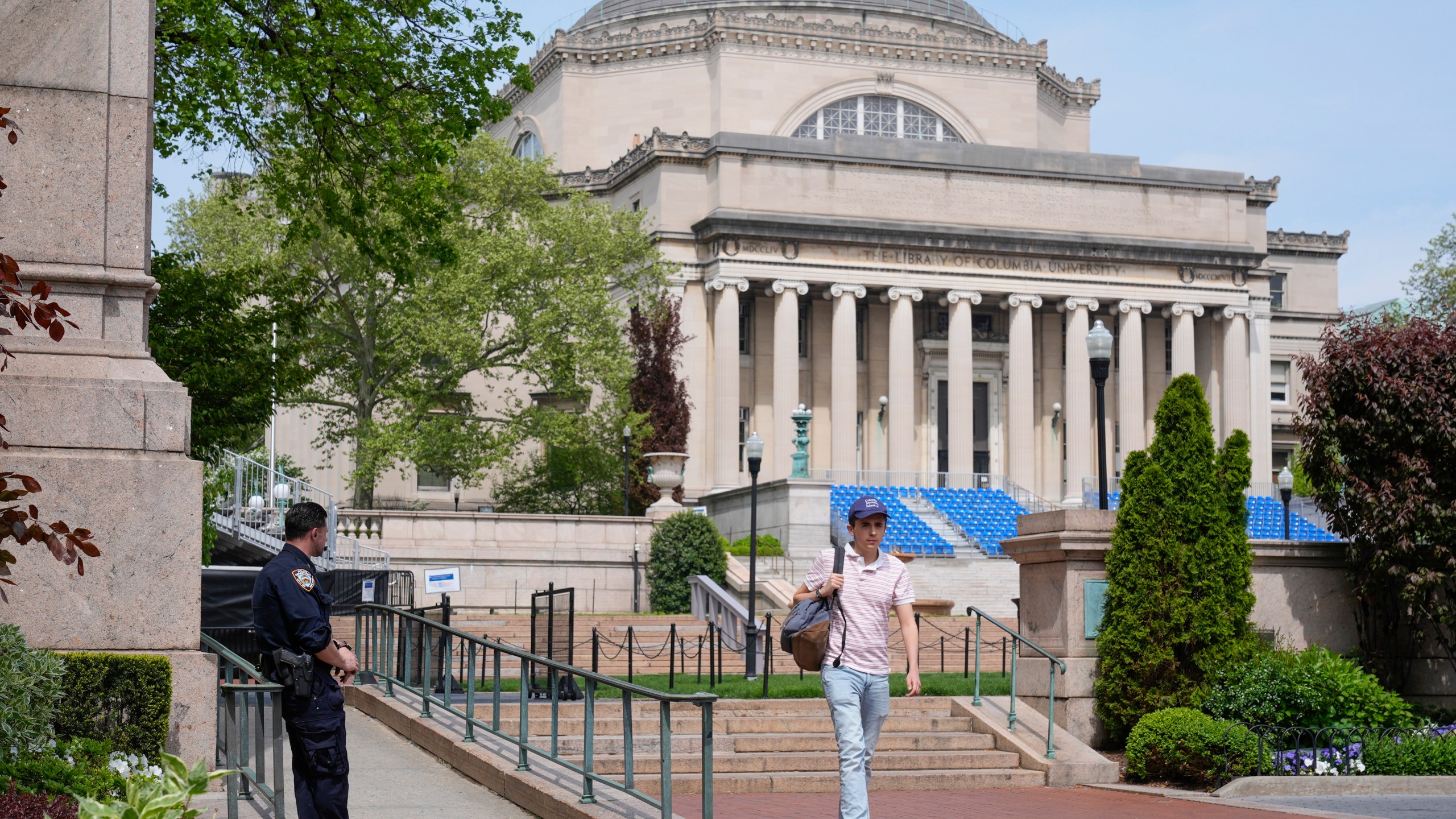 FILE - A New York City police officer keeps watch on the campus of Columbia University in New York, Monday, May 6, 2024. (AP Photo/Seth Wenig, File)