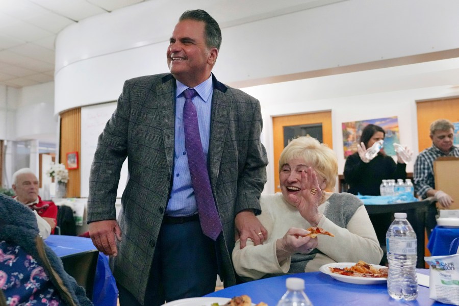 Everett, Mass. Mayor Carlo DeMaria smiles while visiting guests at a senior luncheon following a bingo game at the Connolly Center, Monday, Jan. 13, 2025, in Everett. (AP Photo/Charles Krupa)
