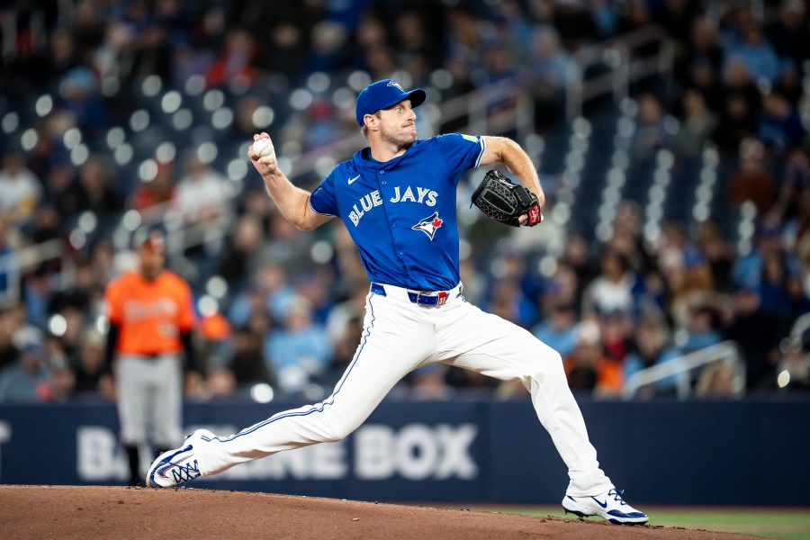 Toronto Blue Jays pitcher Max Scherzer (31) throws during the first inning of baseball game against the Baltimore Orioles Saturday, March 29, 2025, in Toronto. (Christopher Katsarov/The Canadian Press via AP)