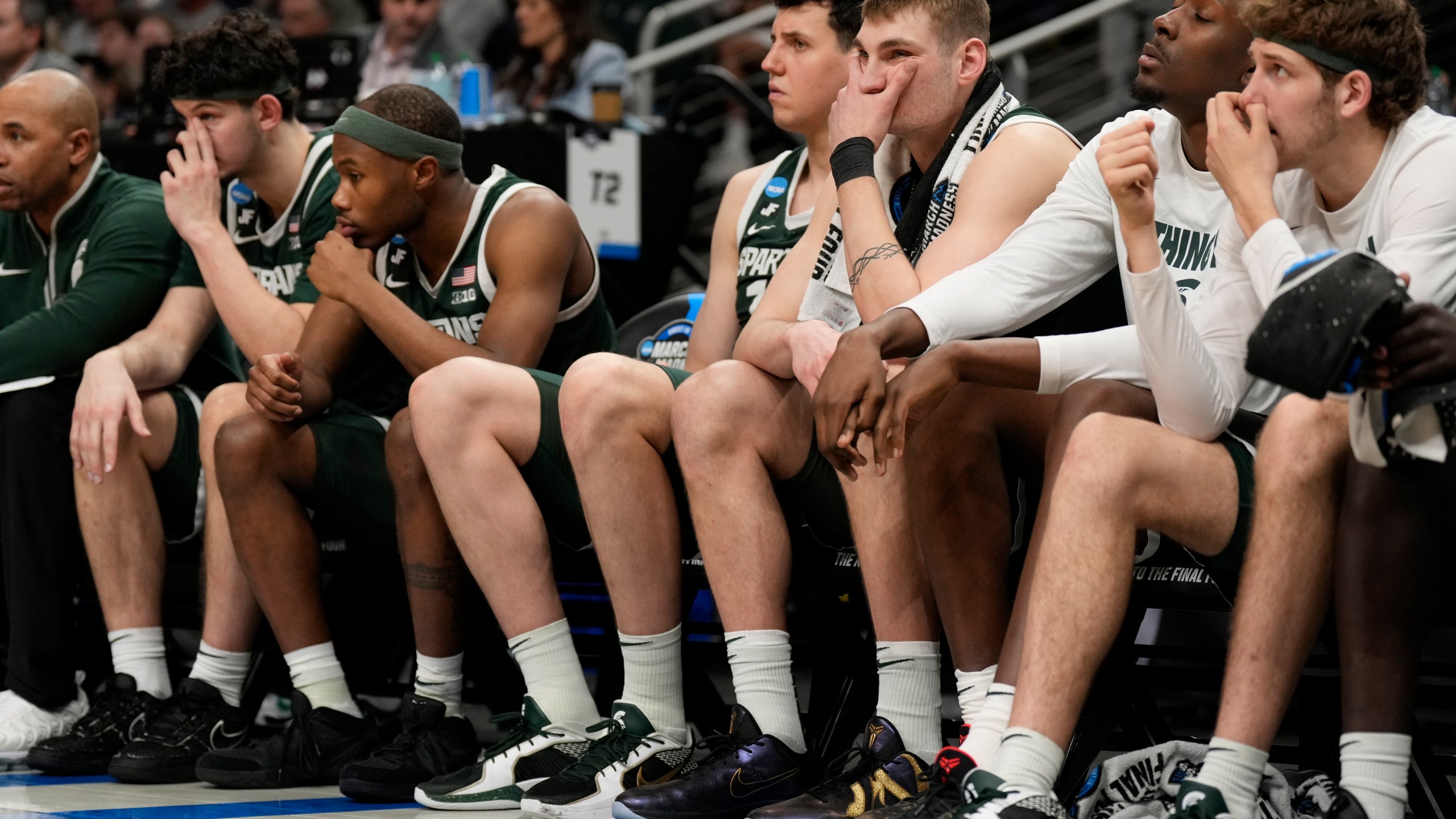 The Michigan State bench watches play against Auburn during the second half in the Elite Eight of the NCAA college basketball tournament, Sunday, March 30, 2025, in Atlanta. (AP Photo/George Walker IV)