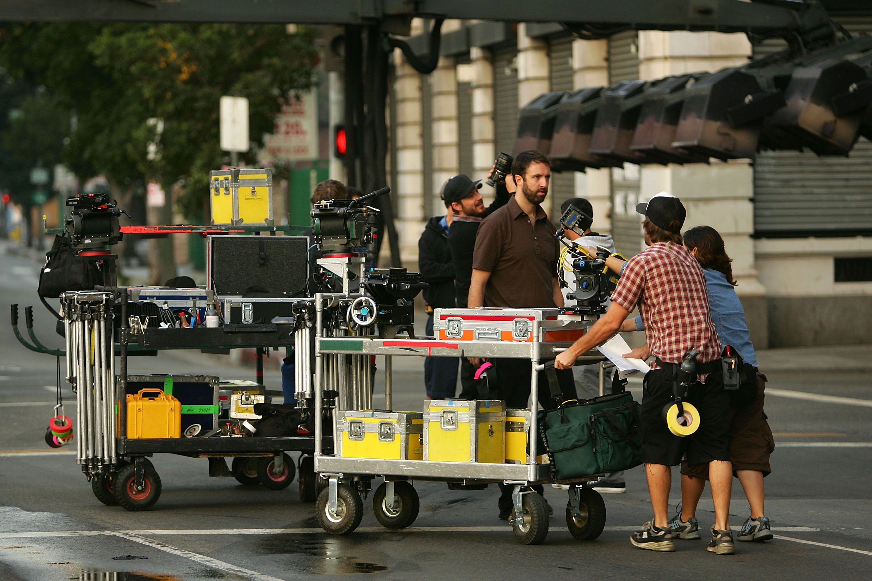 A crew sets up cameras for the filming a mobile phone commercial on-location on November 18, 2006 in Los Angeles, California. (Photo by David McNew/Getty Images)