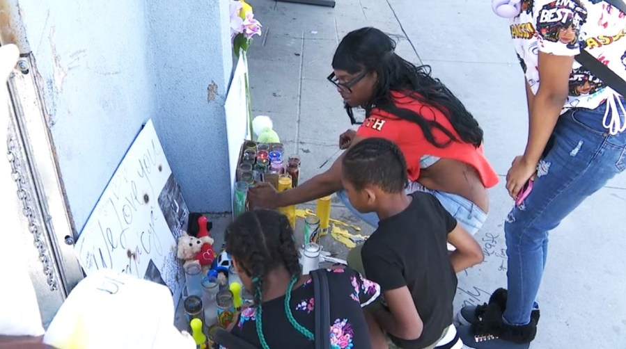 Loved ones gathered to honor Ma'Cya Clark, 4, at a sidewalk memorial on March 22, 2024. The boy was killed in a hit-and-run crash in the Baldwin Hills/Crenshaw neighborhood. (KTLA)