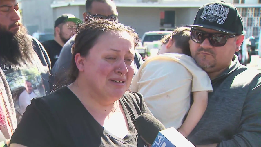 The victim's wife, Regan Porter, speaks to KTLA about her husband as friends and family work to raise money at a car wash fundraiser in Chino on March 8, 2025. (KTLA)