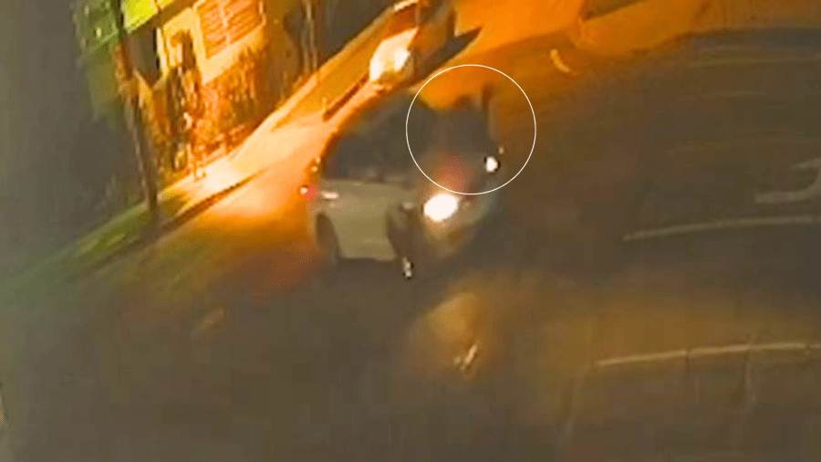 Surveillance footage showed the victim crossing Figueroa Street near 104th Place in South L.A. when he was struck and killed by a hit-and-run driver in a white sedan on Feb. 24, 2025. (Los Angeles Police Department)