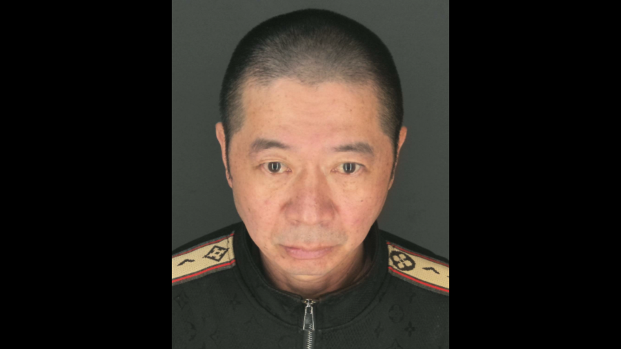 The suspect, Quan Lin, 53, of El Monte, is seen in a booking photo provided by the El Monte Police Department.