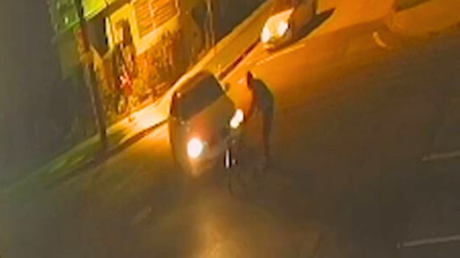 Surveillance footage showed the victim crossing Figueroa Street near 104th Place in South L.A. when he was struck and killed by a hit-and-run driver in a white sedan on Feb. 24, 2025. (Los Angeles Police Department)