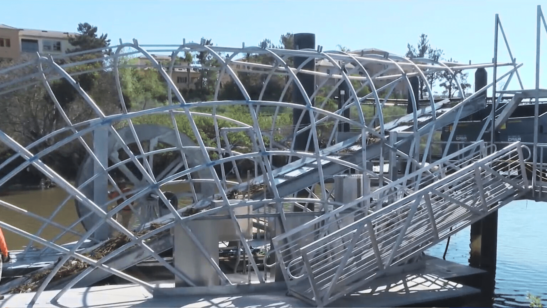 The Newport Bay Trash Interceptor collects floating trash and debris before it enters and contaminates the local bay, harbor and beaches. An estimated 100 to 500 tons of trash a year enters the waterways and the interceptor is expected to reduce up to 80% of it. (KTLA)