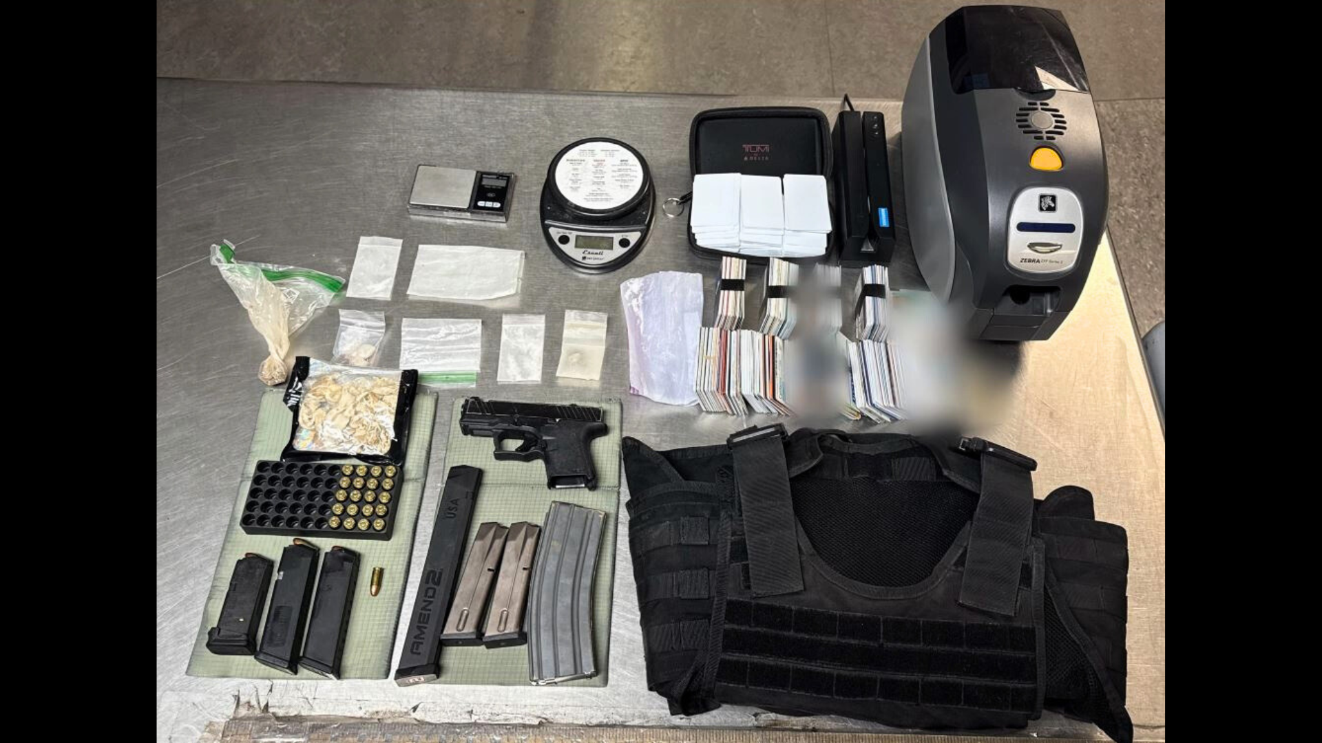 Investigators found a loaded homemade Polymer 80 pistol, several ammunition magazines, tactical body armor, bags of suspected methamphetamine, digital scales, stolen mail and credit cards and more during a search warrant at the suspect’s Victorville home on March 13, 2035. (San Bernardino County Sheriff’s Department)