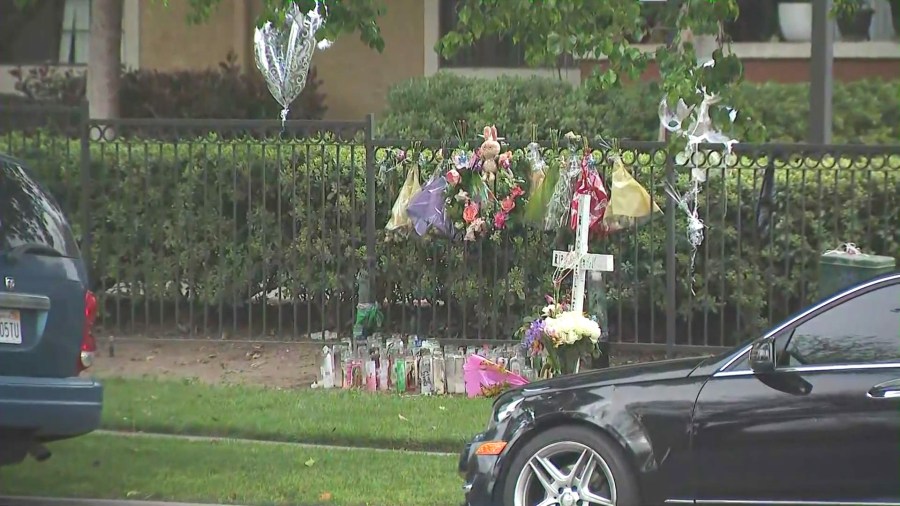 Friends and loved ones created a memorial outside Rachelle Lopez's apartment to honor her. (KTLA)