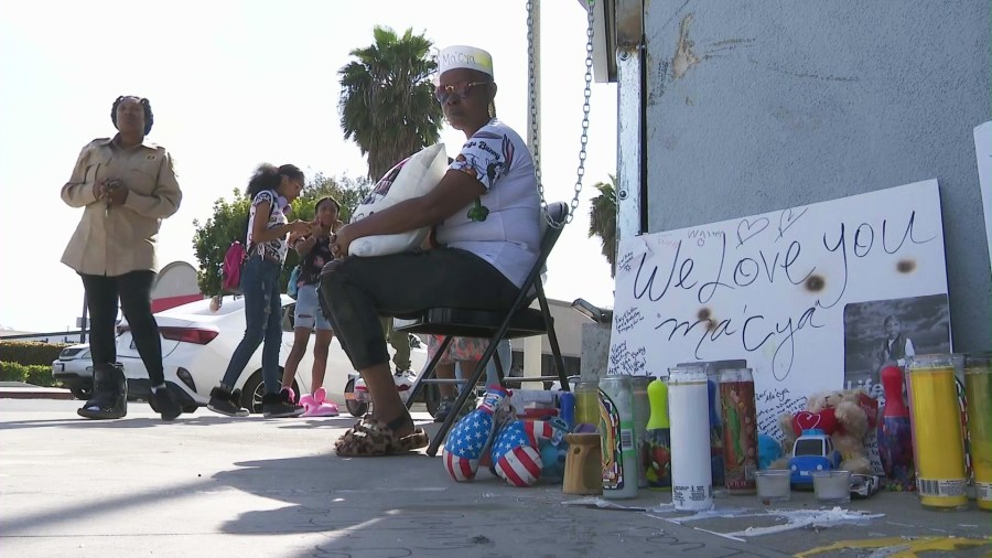 Loved ones gathered to honor Ma'Cya Clark, 4, at a sidewalk memorial on March 22, 2024. The boy was killed in a hit-and-run crash in the Baldwin Hills/Crenshaw neighborhood. (KTLA)