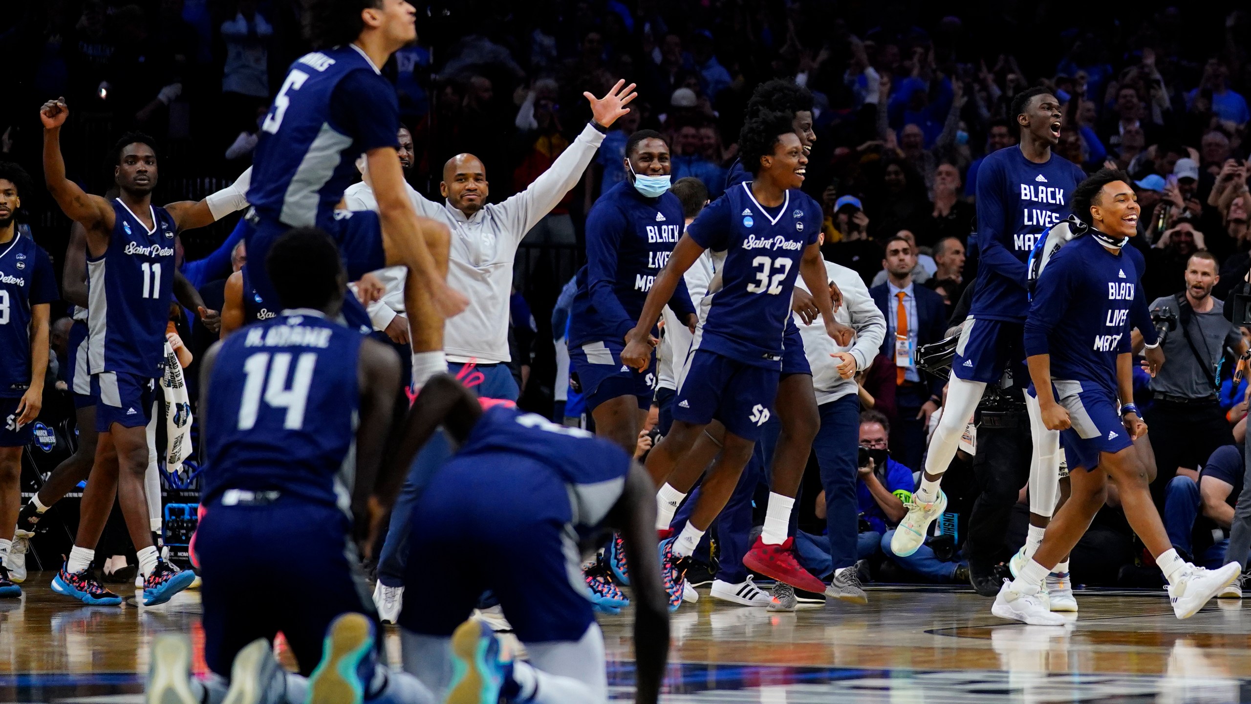 FILE - Saint Peter's celebrates after winning a college basketball game against Purdue in the Sweet 16 round of the NCAA tournament, March 25, 2022, in Philadelphia. (AP Photo/Matt Rourke, File)