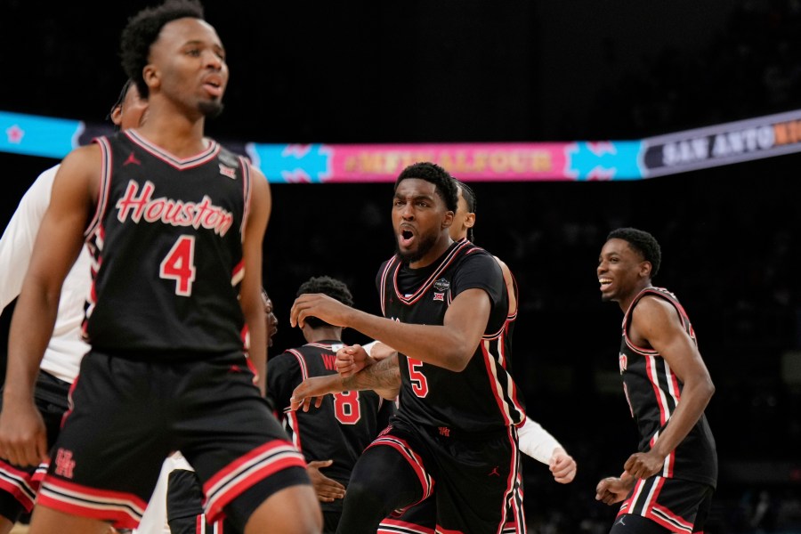 Houston's Ja'Vier Francis (5) celebrates with teammates after Houston beat Duke in the national semifinals at the Final Four of the NCAA college basketball tournament, Saturday, April 5, 2025, in San Antonio. (AP Photo/Eric Gay)