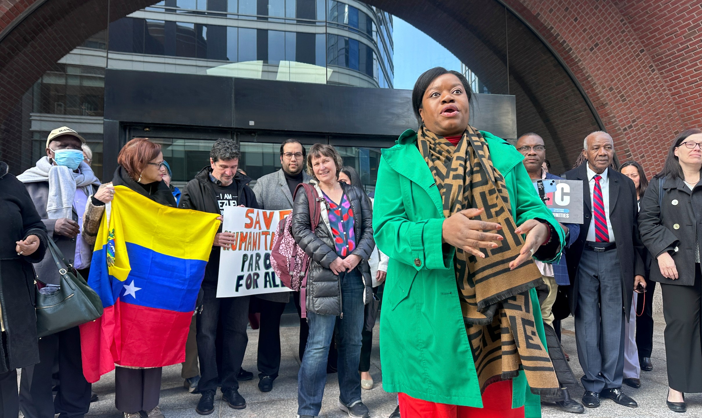 Immigration advocates speak Thursday, April 10, 2025, outside federal court in Boston, after a hearing aiming to halt the Trump administration's from stopping a program that allowed hundreds of thousands of Cubans, Haitians, Nicaraguans, and Venezuelans to temporarily live in the country. (AP Photos/Michael Casey)