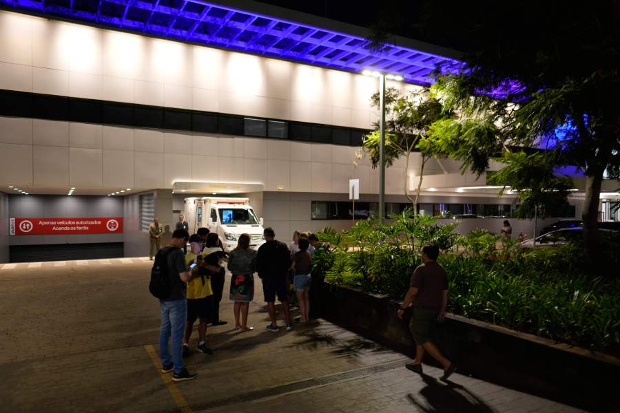 Supporters hold a vigil for former Brazilian President Jair Bolsonaro after he transferred to a DF Star hospital with abdominal pain in Brasilia, Brazil, Saturday, April 12, 2025. (AP Photo/Eraldo Peres)