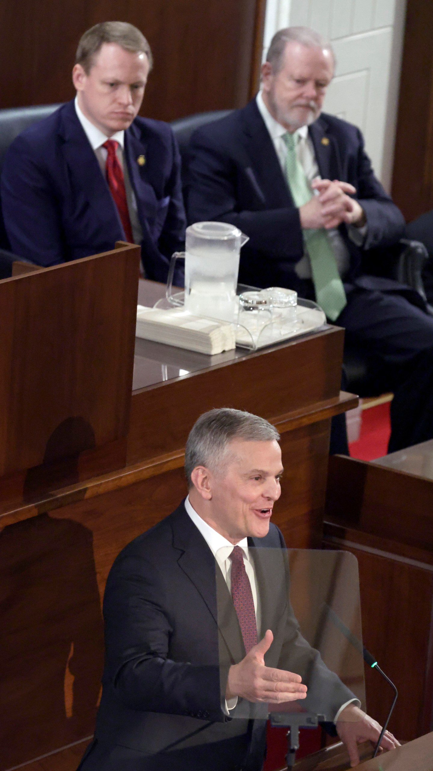 Speaker of the House Destin Hall, R-Caldwell, top left, and Senate leader Phil Berger, R-Rockingham, top right, listen as North Carolina Gov. Josh Stein, bottom, delivers the State of the State address at the Legislative Building, Wednesday, March 12, 2025, in Raleigh N.C. (AP Photo/Chris Seward)
