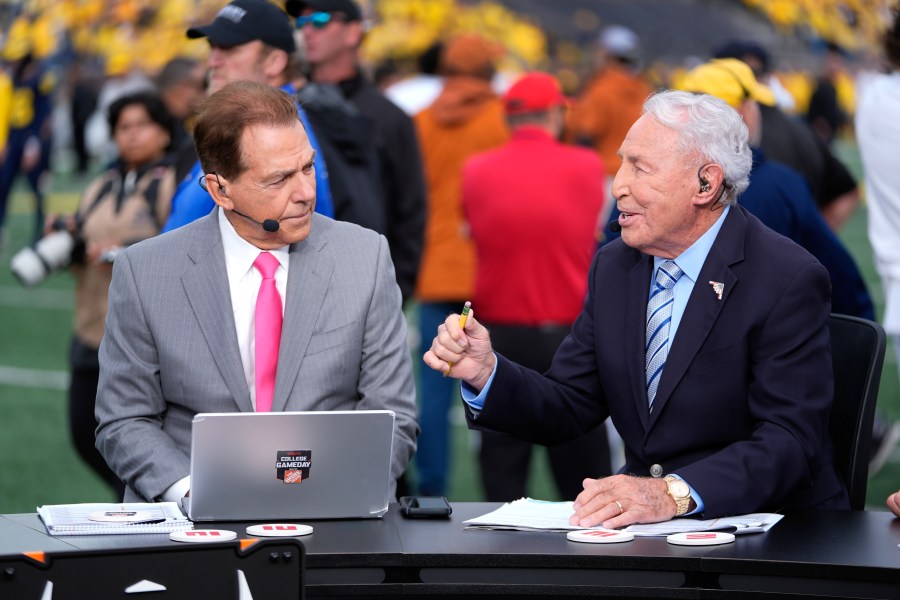 FILE - Nick Saban, left, and Lee Corso talk on the set of ESPN College Gameday on the sideline before an NCAA college football game between Michigan and Texas in Ann Arbor, Mich., Sept. 7, 2024. (AP Photo/Paul Sancya, File)
