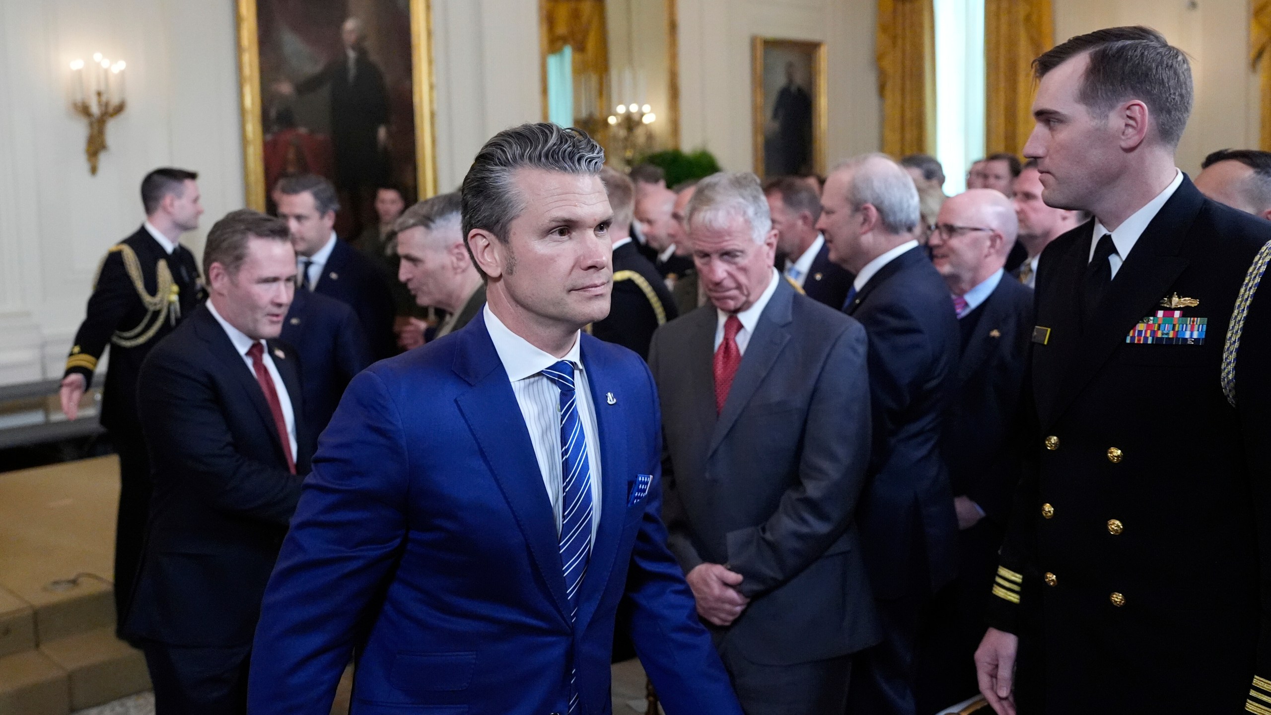 Defense Secretary Pete Hegseth departs the Commander-in-Chief trophy presentation to the Navy Midshipman football team in the East Room of the White House, Tuesday, April 15, 2025, in Washington. (AP Photo/Alex Brandon)