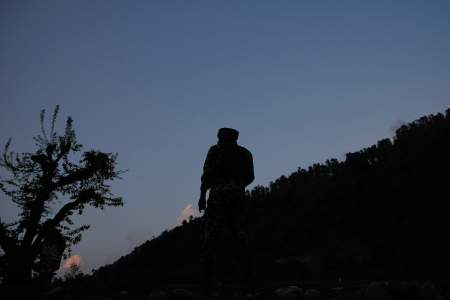 An Indian security officer stands guard in south Kashmir after assailants indiscriminately opened fired at tourists in Pahalgam, Indian controlled Kashmir, Tuesday, April 22, 2025. (AP Photo/Dar Yasin)