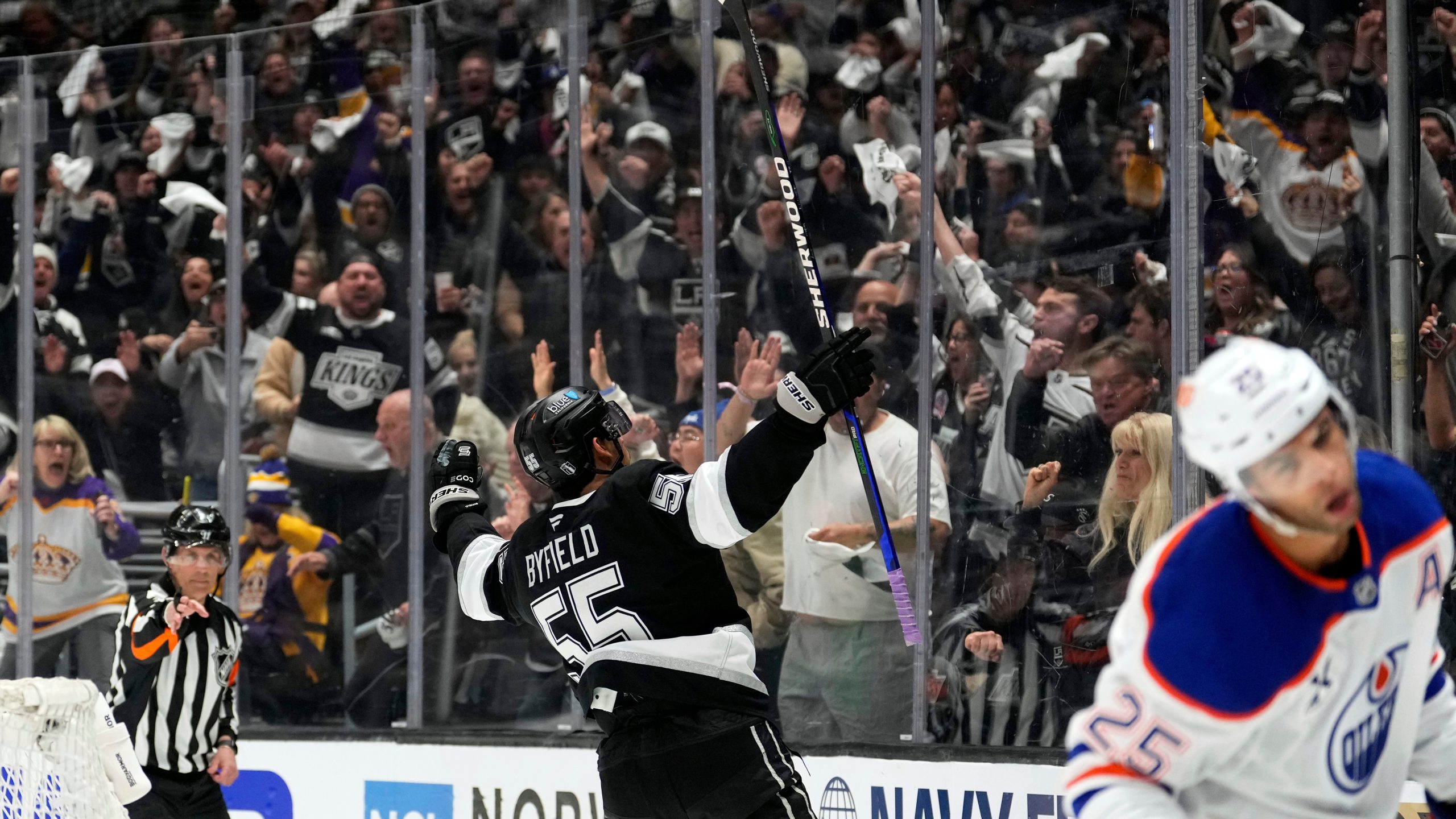Los Angeles Kings right wing Quinton Byfield celebrates his goal as Edmonton Oilers defenseman Darnell Nurse skates away during the second period in Game 2 of an NHL hockey first-round playoff series Wednesday, April 23, 2025, in Los Angeles. (AP Photo/Mark J. Terrill)