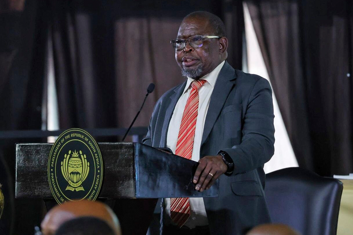 In this photo provided by the South African Government Communications and Information Services (GCIS), the Finance Minister Enoch Godongwana speaks before the vote for national budget for 2025 in the National Assembly, in Cape Town, South Africa, Wednesday, April 2, 2025. (Jairus Mmutle/GCIS via AP)