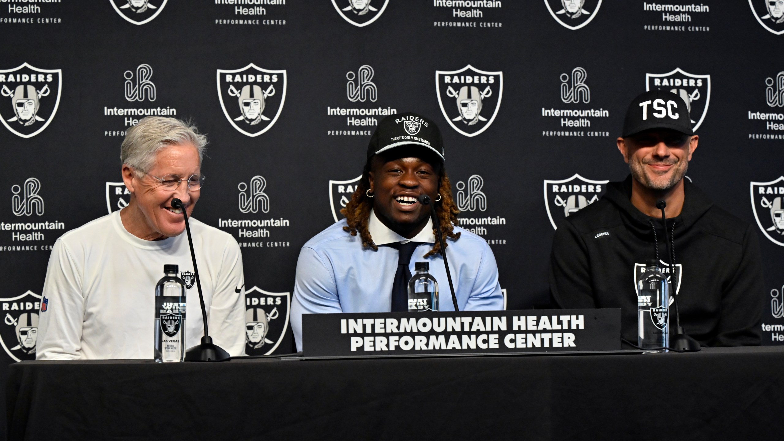 Las Vegas Raiders first-round draft pick Ashton Jeanty, center, speaks as head coach Pete Carroll, left, and general manager John Spytek look on during an NFL football news conference Friday, April 25, 2025, in Henderson, Nev. (AP Photo/David Becker)