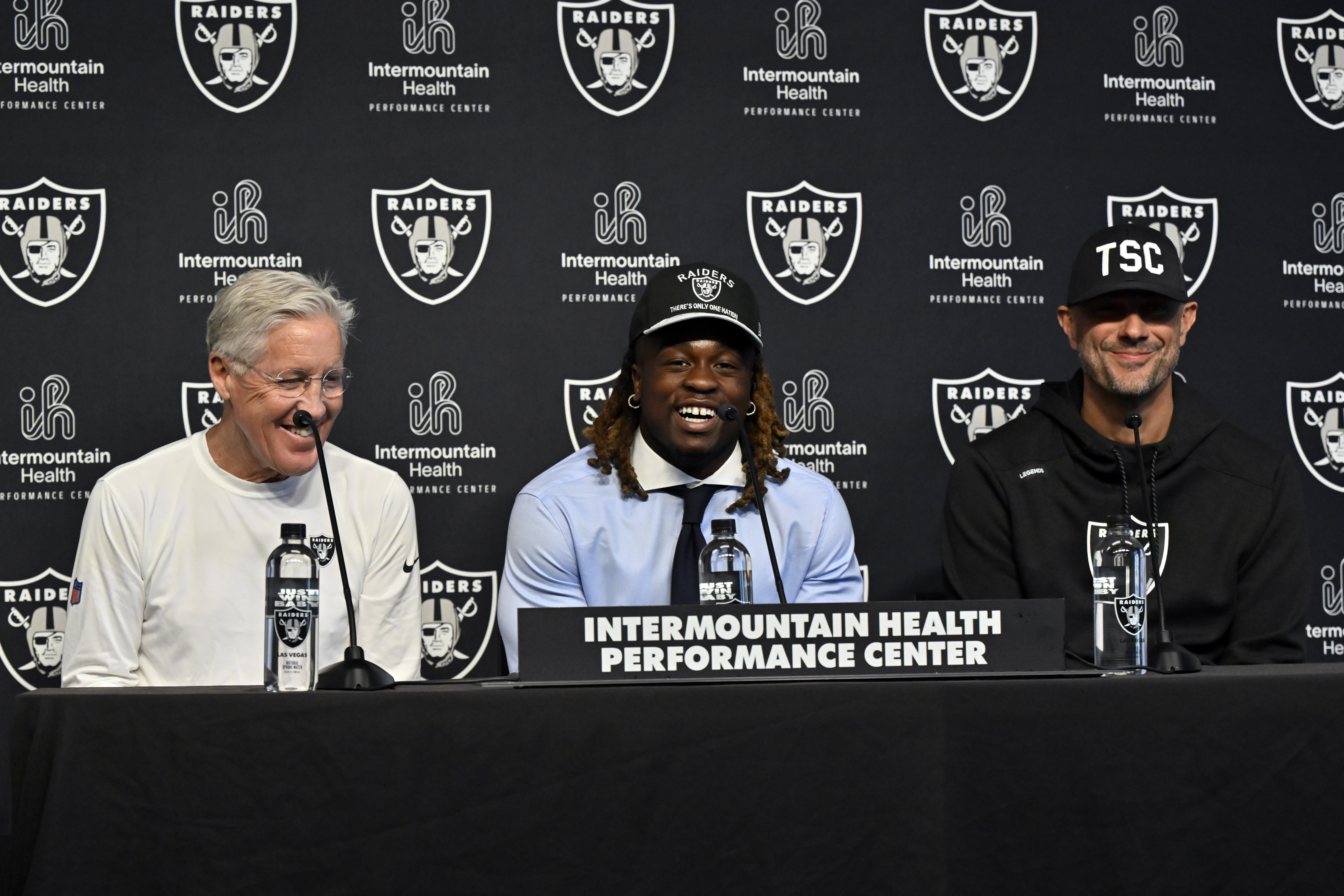 Las Vegas Raiders first-round draft pick Ashton Jeanty, center, speaks as head coach Pete Carroll, left, and general manager John Spytek look on during an NFL football news conference Friday, April 25, 2025, in Henderson, Nev. (AP Photo/David Becker)