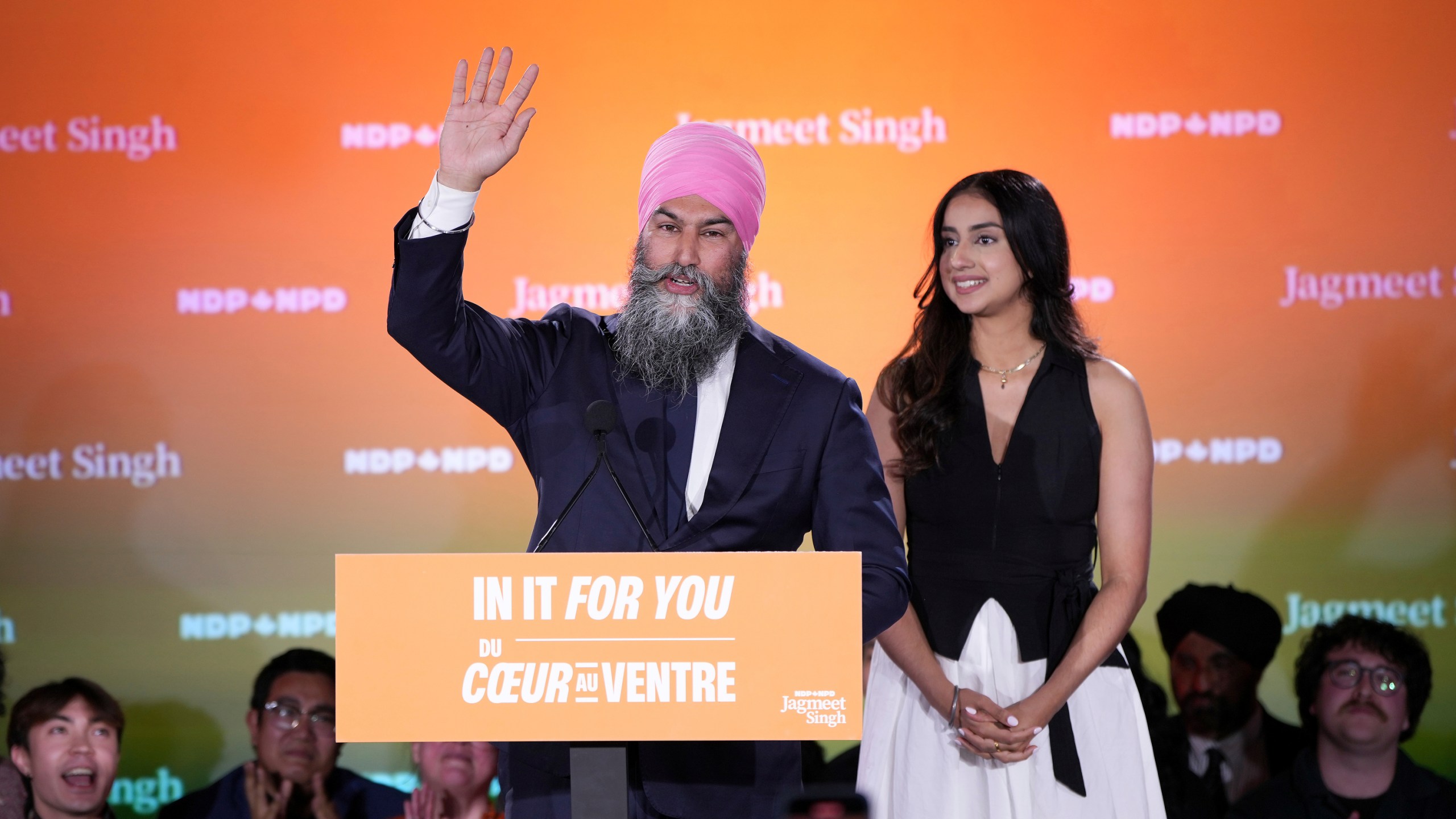 New Democratic Party Leader Jagmeet Singh addresses supporters accompanied by his wife Gurkiran Kaur at his campaign headquarters on election night, in Burnaby, B.C., Monday, April 28, 2025. (Ethan Cairns/The Canadian Press via AP)