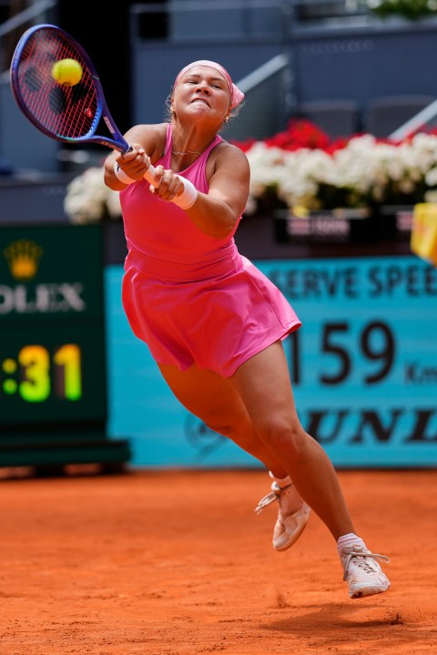 Russia's Diana Shnaider returns the ball against Iga Swiatek of Poland during the Madrid Open tennis tournament in Madrid, Spain, Tuesday, April 29, 2025. (AP Photo/Manu Fernandez)
