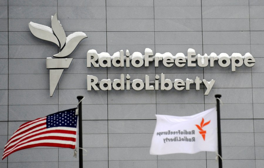 FILE - The headquarters of Radio Free Europe/Radio Liberty is seen with the United States flag in the foreground, Jan. 15, 2010, in Prague. (Michal Kamaryt/CTK via AP, File)