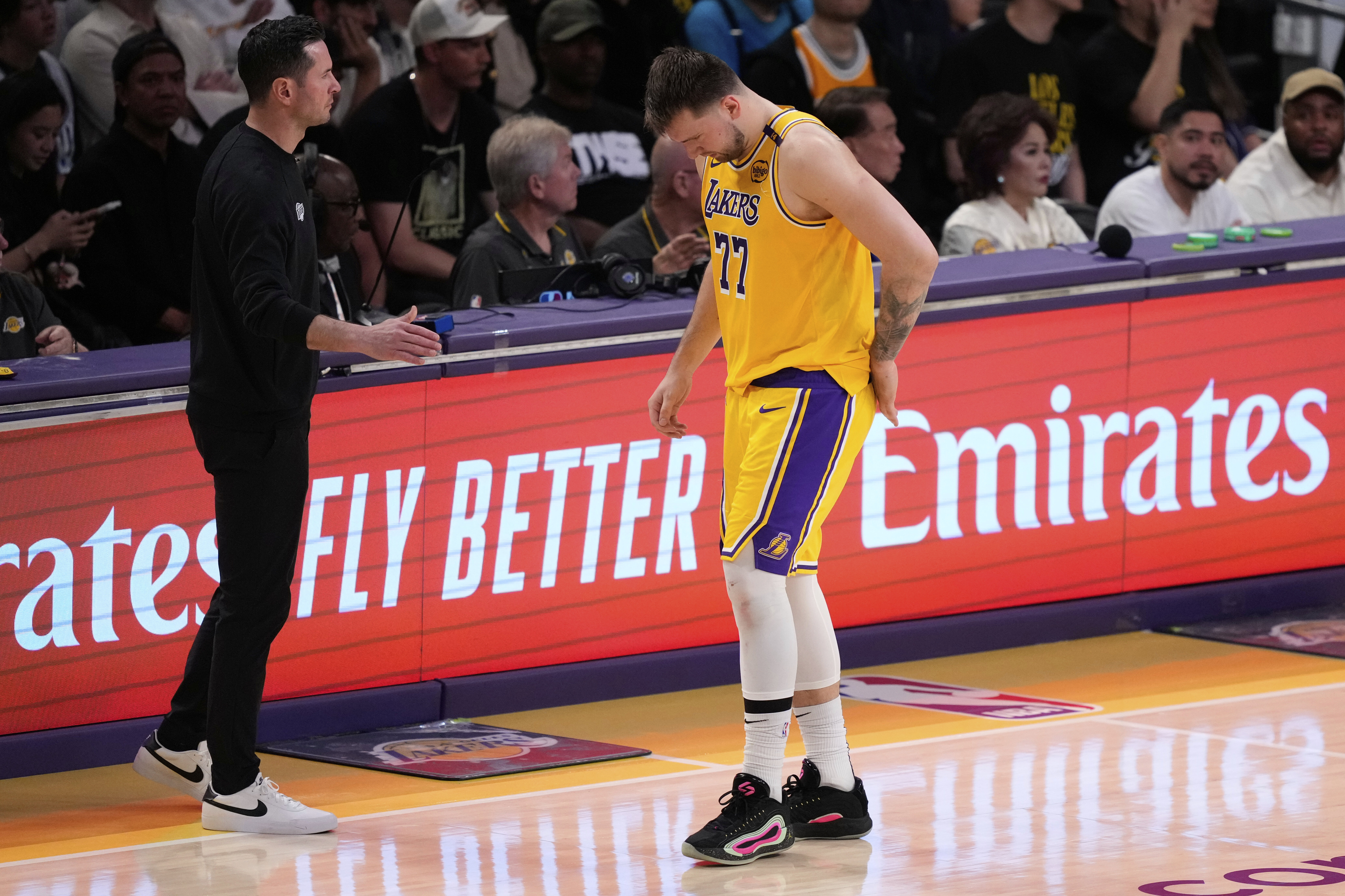 Los Angeles Lakers guard Luka Doncic (77) walks off the court after an injury during the first half in Game 5 of an NBA basketball first-round playoff series against the Minnesota Timberwolves, Wednesday, April 30, 2025, in Los Angeles. (AP Photo/Mark J. Terrill)