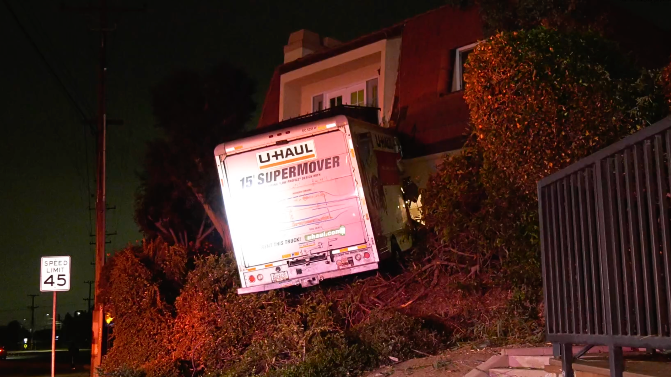 Orange U-Haul into apartment