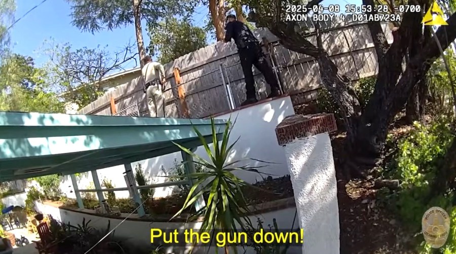 Body cam footage shows LAPD officers surrounding Jillian Shriner's backyard and ordering her to put her gun down on April 8, 2025. (Los Angeles Police Department)