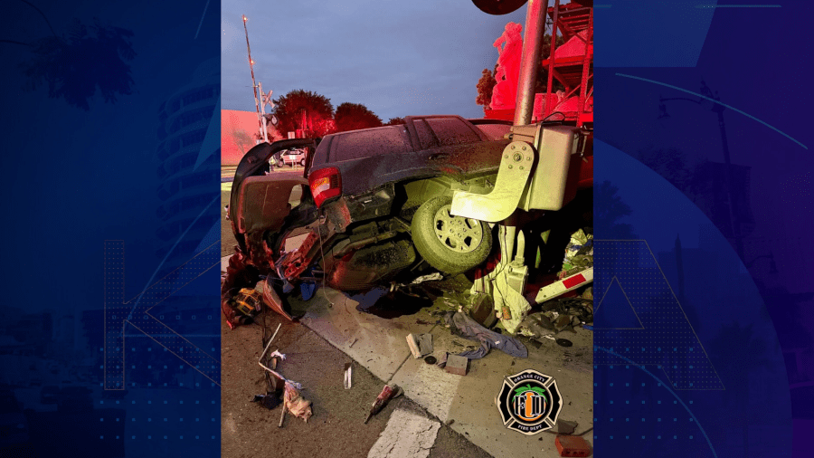 A man was hospitalized in critical condition after he allegedly drove his car under a railroad barrier and was struck by a passenger train in Orange on April 17, 2025. (Orange City Fire Department)