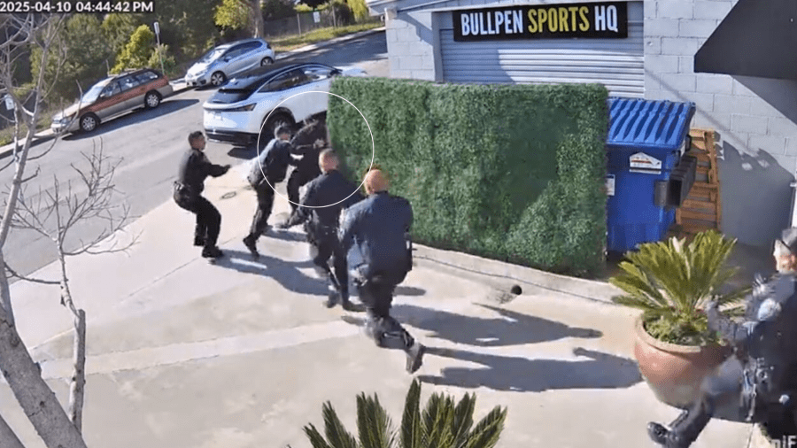 Surveillance footage outside Bullpen Sports HQ in El Segundo shows the male suspect being tackled by police while trying to flee on April 10, 2025. (Bullpen Sports HQ)