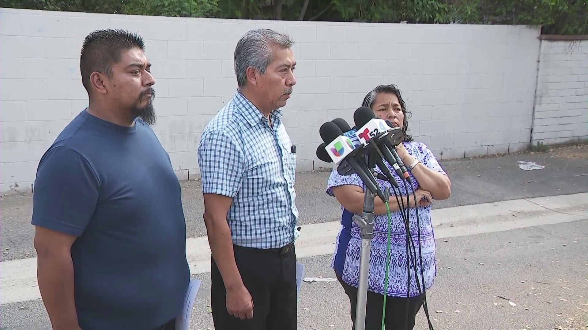 Martin Majin Leon (center) holds a press conference with his family as he speaks to the media outside his Pomona barber shop on April 24, 2025. (KTLA)