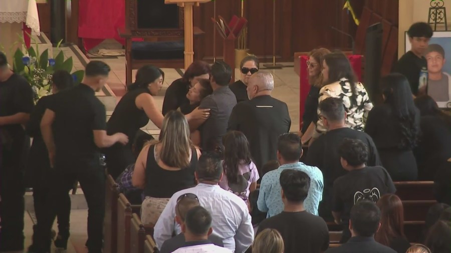 The boy's mother appeared to faint after approaching her son's casket as loved ones gathered at the Immaculate Heart of Mary Catholic Church to honor Oscar Omar Hernandez, 13, in East Hollywood on April 12, 2025. (KTLA)