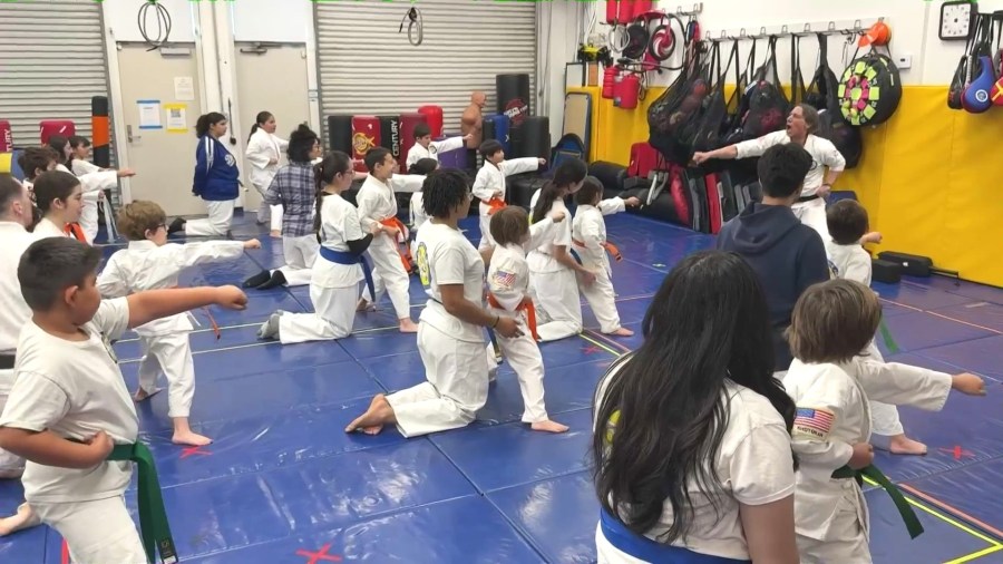 Children with special needs and their parents attend a session at Karate For All in Tustin. (KTLA)