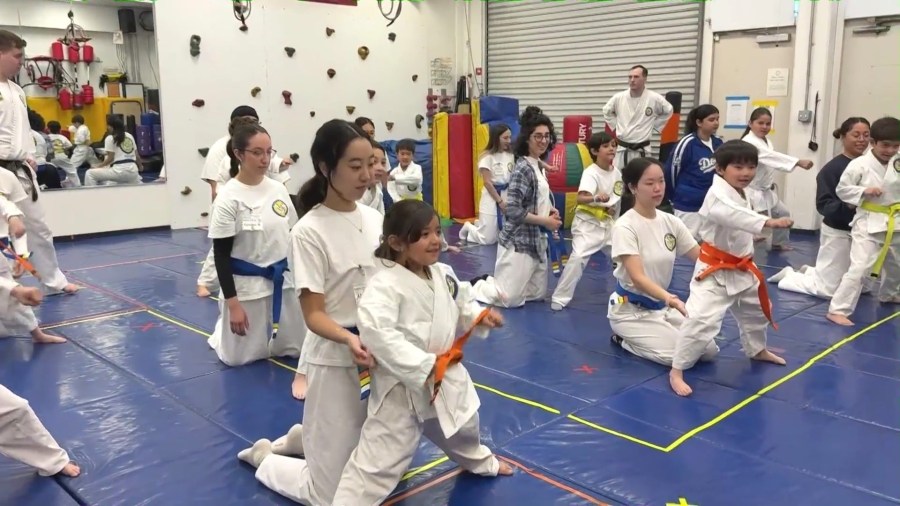 Children with special needs and their parents attend a session at Karate For All in Tustin. (KTLA)