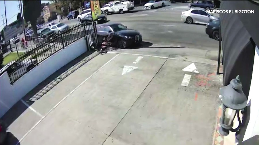 Surveillance cameras captured a hit-and-run driver in a BMW sedan crashing into Sebastian Carillo, 15, as he rode his bicycle on a sidewalk in South Los Angeles on April 7, 2025. (Mariscos El Bigoton)
