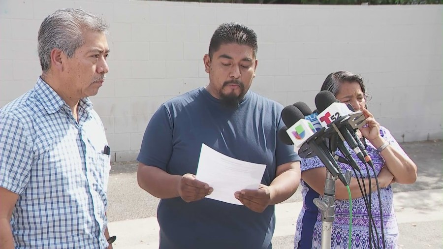 Miguel Majin (center) reads a letter from his father that was translated into English from Spanish as they held a press conference in Pomona on April 24, 2025. (KTLA)