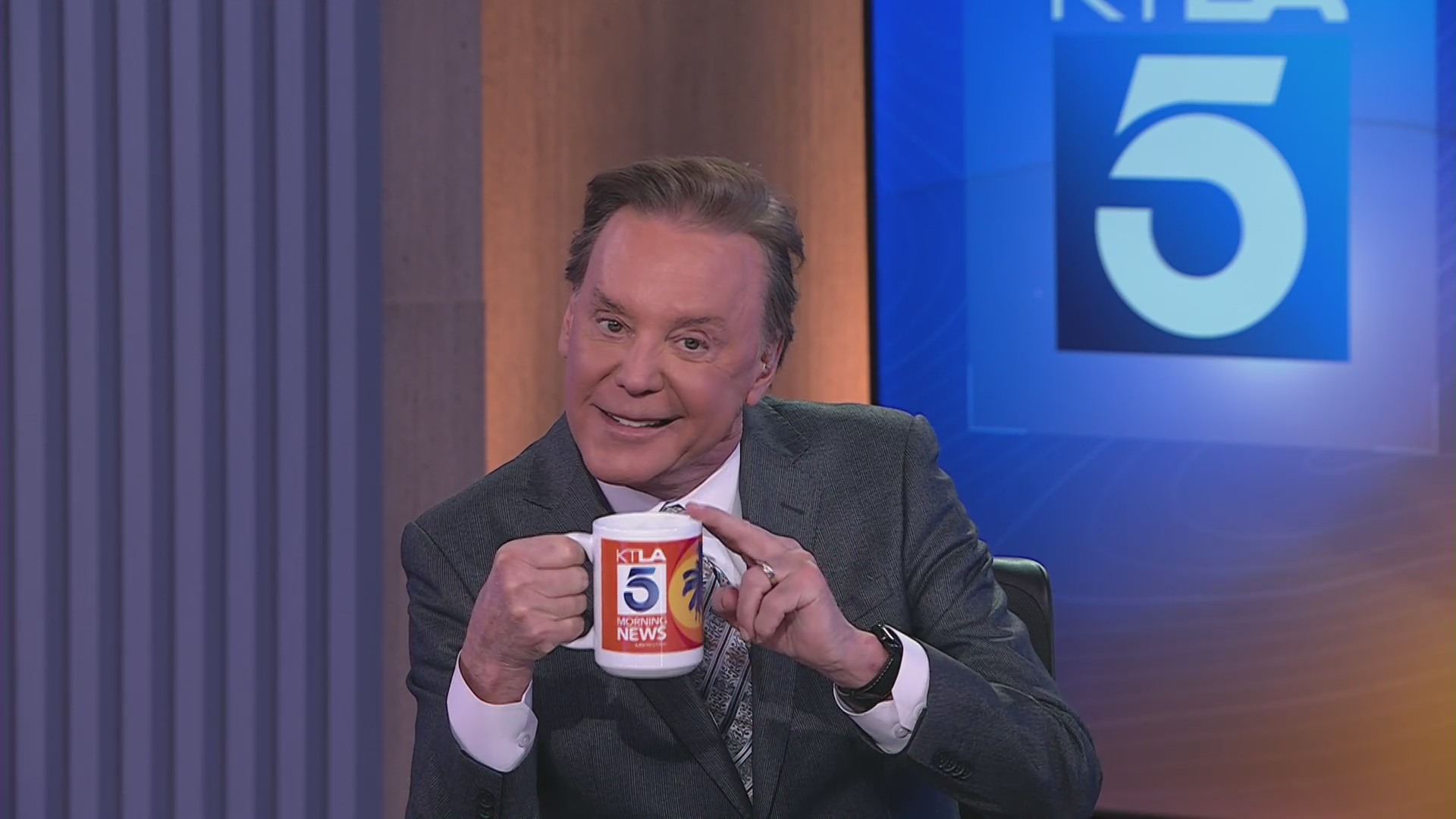 KTLA's Mark Kriski shows off the new Morning News mug.
