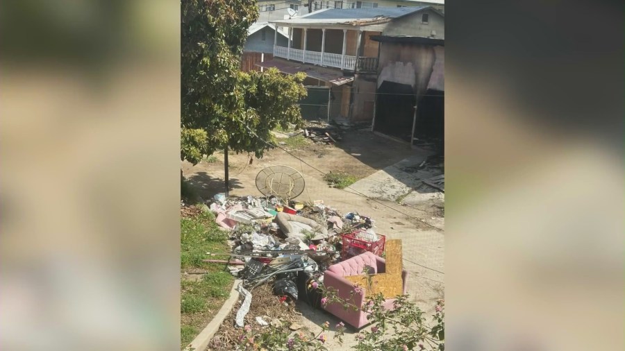 The backyard view of a vacant building on Wilton Place in Hollywood that neighbors said have attracted a constant stream of homeless people, dangerous criminal activity and even some visitors who have started fires. (KTLA)