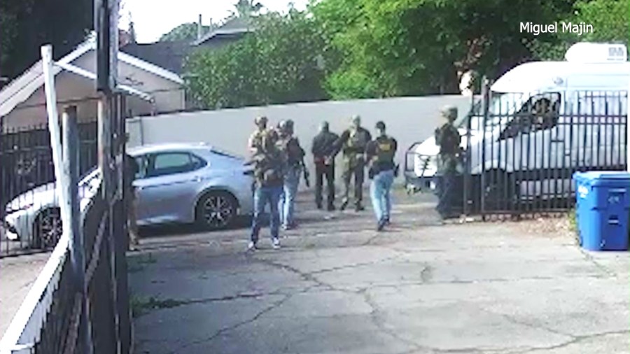 Surveillance video showed Martin Majin Leon being surrounded at gunpoint and taken into custody by immigration officials outside his barber shop in Pomona on April 22, 2025. (Miguel Majin)