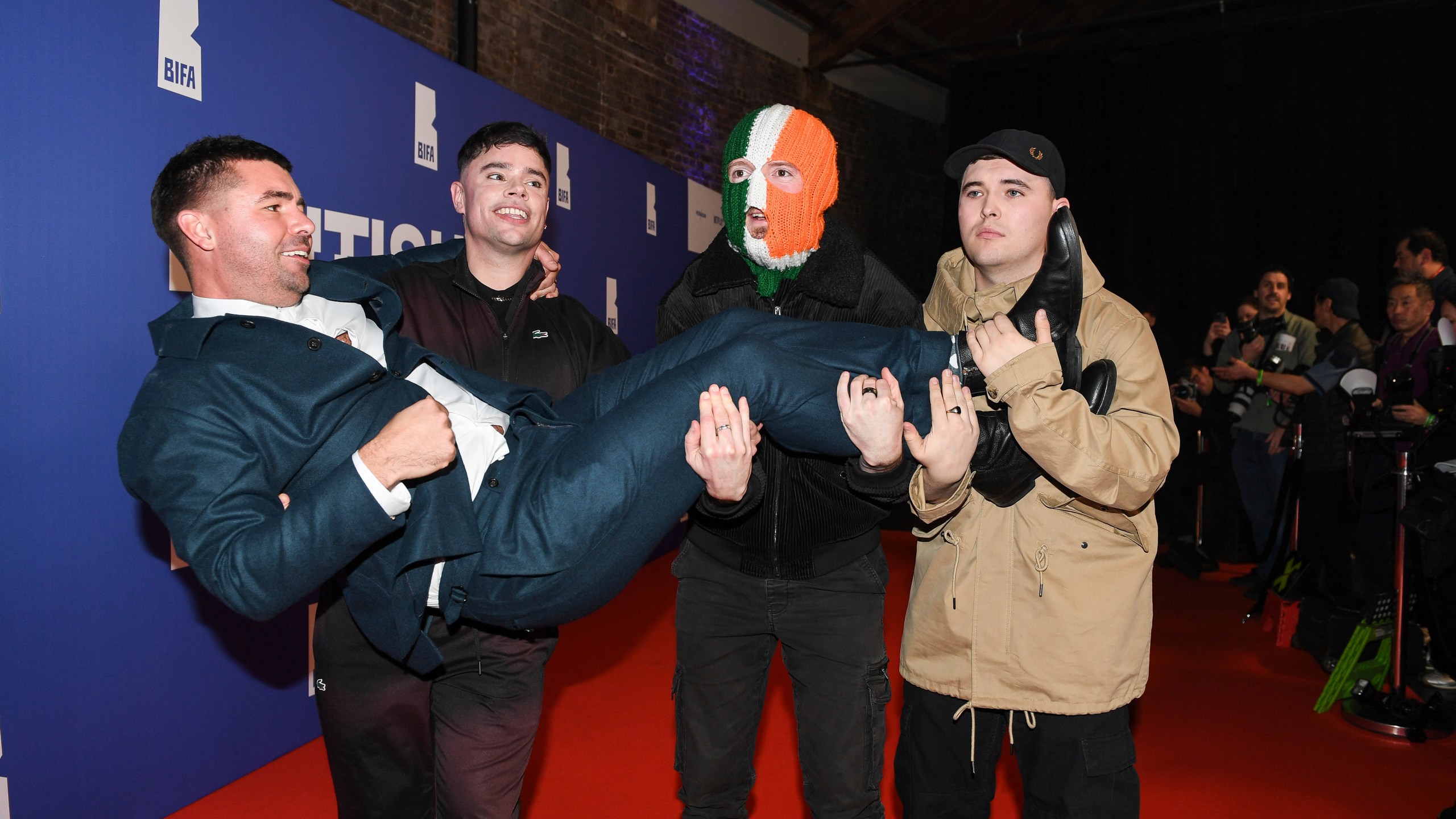 FILE - Rich Peppiatt, Naoise ó Cairealláin, DJ Provaí and Mo Chara of Kneecap pose on arrival at the Britain Independent Film Awards on Sunday, Dec. 8, 2024, in London. (Photo by Thomas Krych/Invision/AP, File)