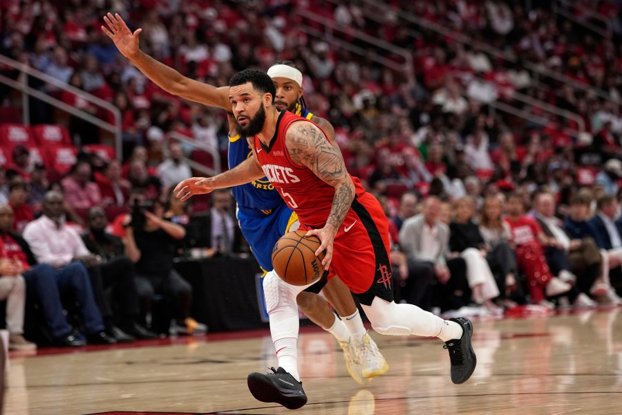 Houston Rockets guard Fred VanVleet (5) drives past Golden State Warriors guard Moses Moody during the first half of Game 5 of an NBA basketball first-round playoff series, Wednesday, April 30, 2025, in Houston. (AP Photo/David J. Phillip)