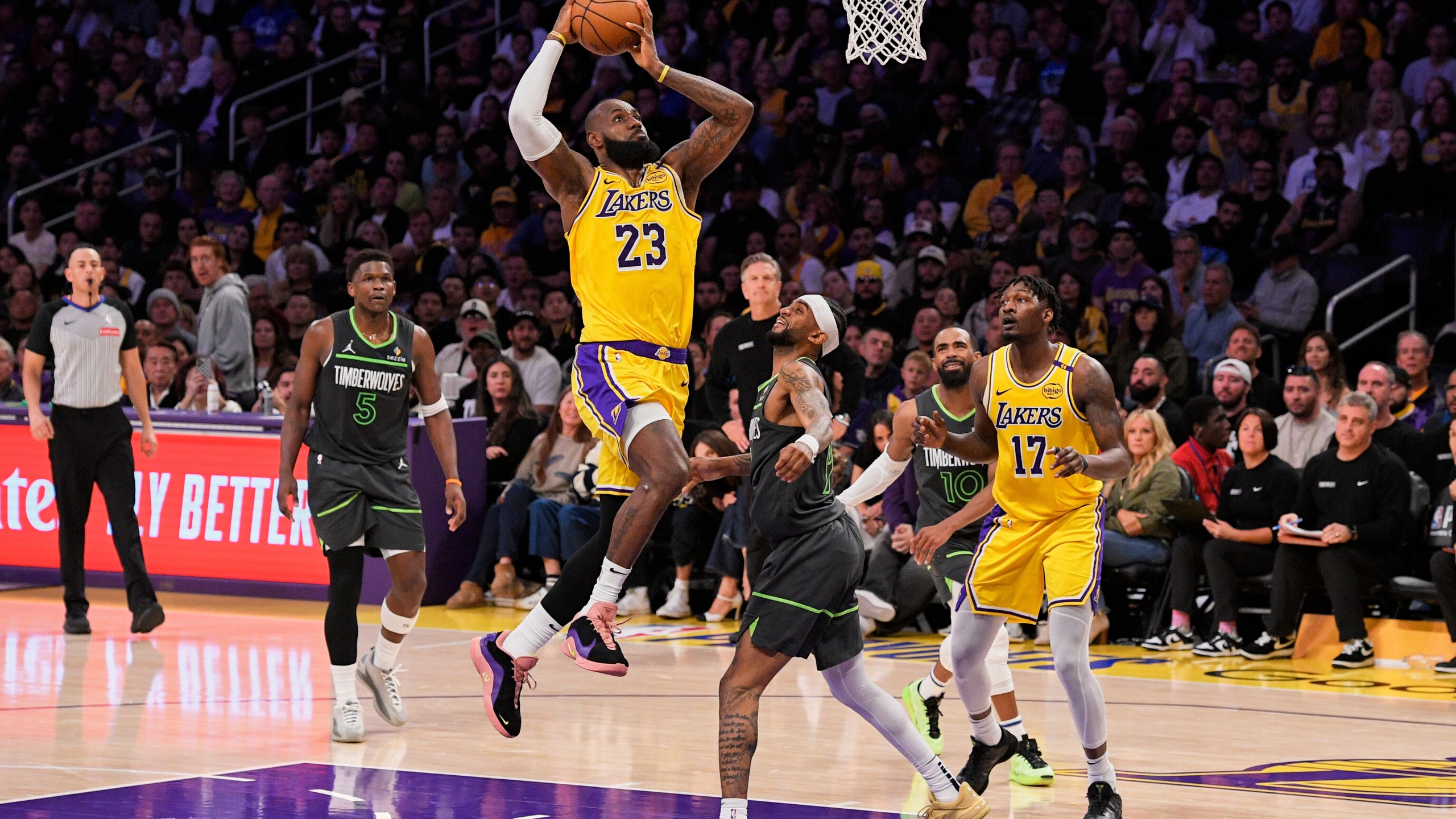 Los Angeles Lakers forward LeBron James (23) shoots as Minnesota Timberwolves guard Nickeil Alexander-Walker (9) defends during the first half in Game 5 of an NBA basketball first-round playoff series Wednesday, April 30, 2025, in Los Angeles. (AP Photo/Mark J. Terrill)